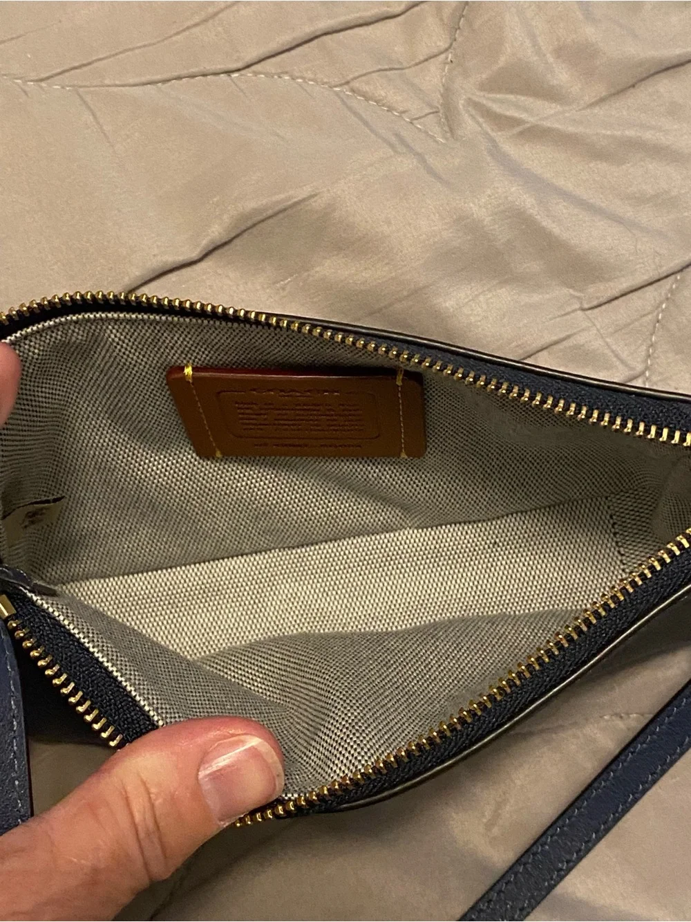 Coach Navy Pebbled Leather Mini Wristlet with Gold Hardware
